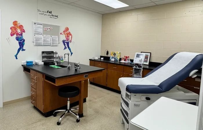 Starbiz cleaner disinfecting an exam room surface at a Sandy Springs medical practice