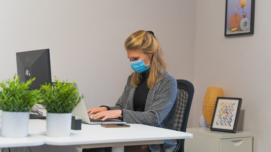 Gloved hands disinfecting a high-touch office surface during flu season