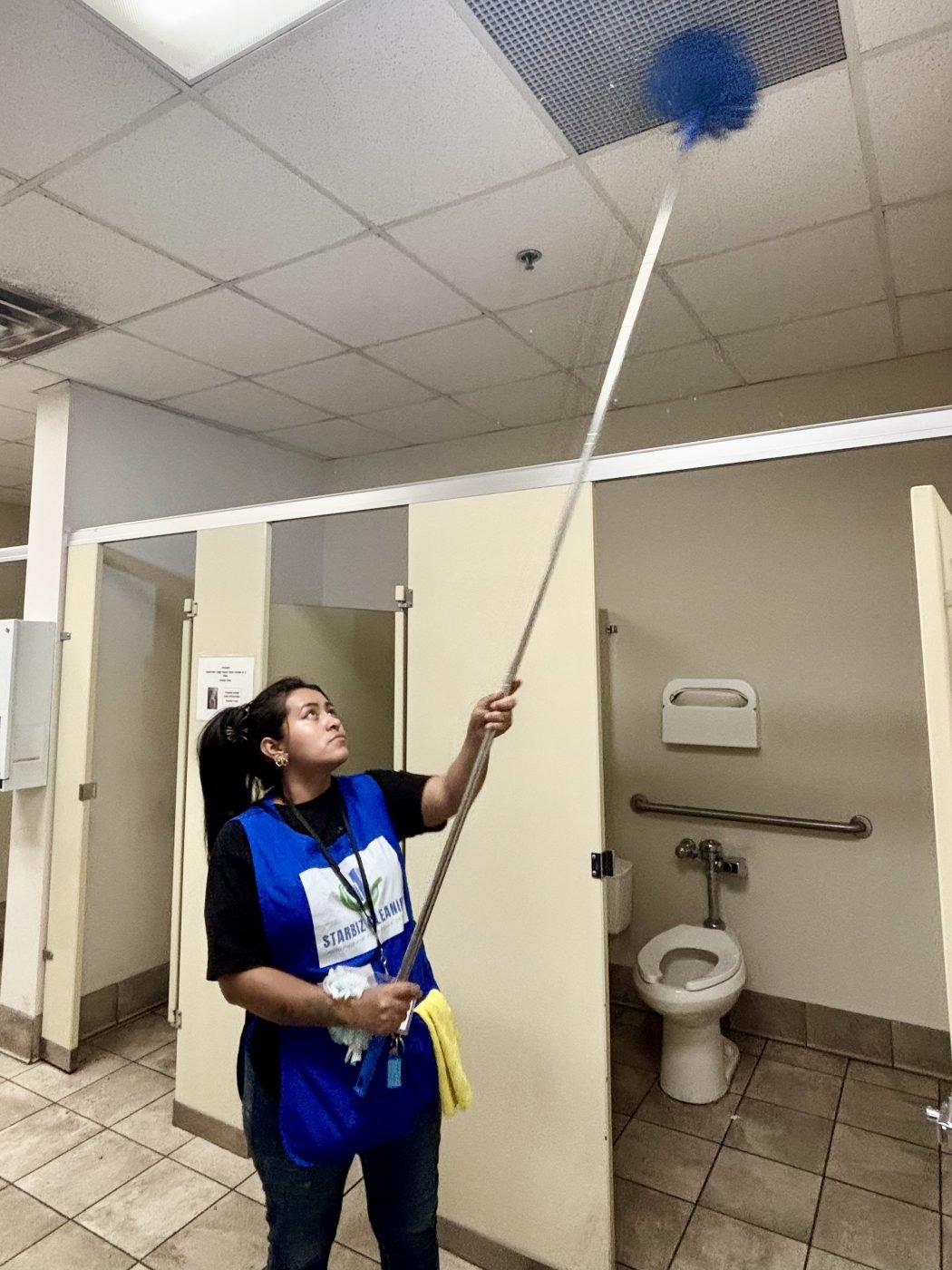 Cleaner cleaning office building restrooms