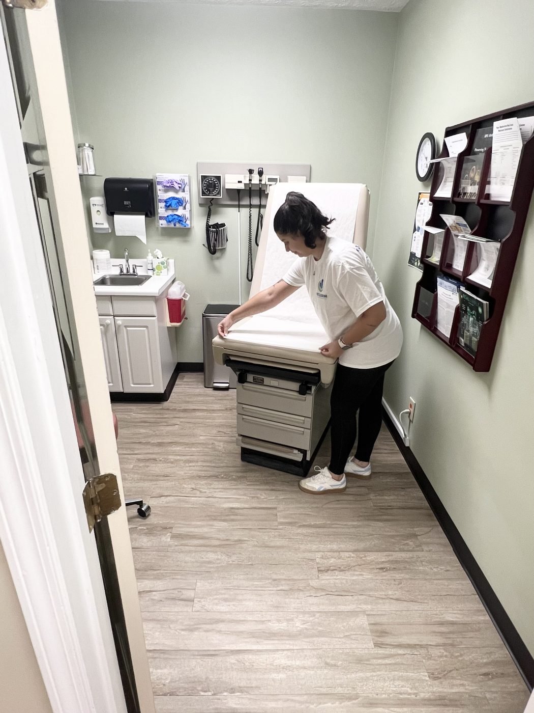 Cleaner cleaning Medical exam room