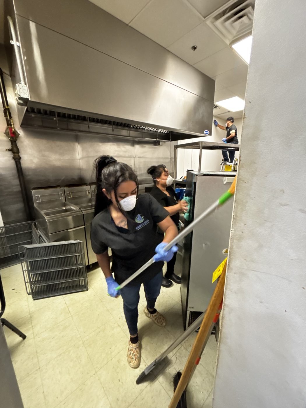 Our crew deep cleaning restaurant kitchen