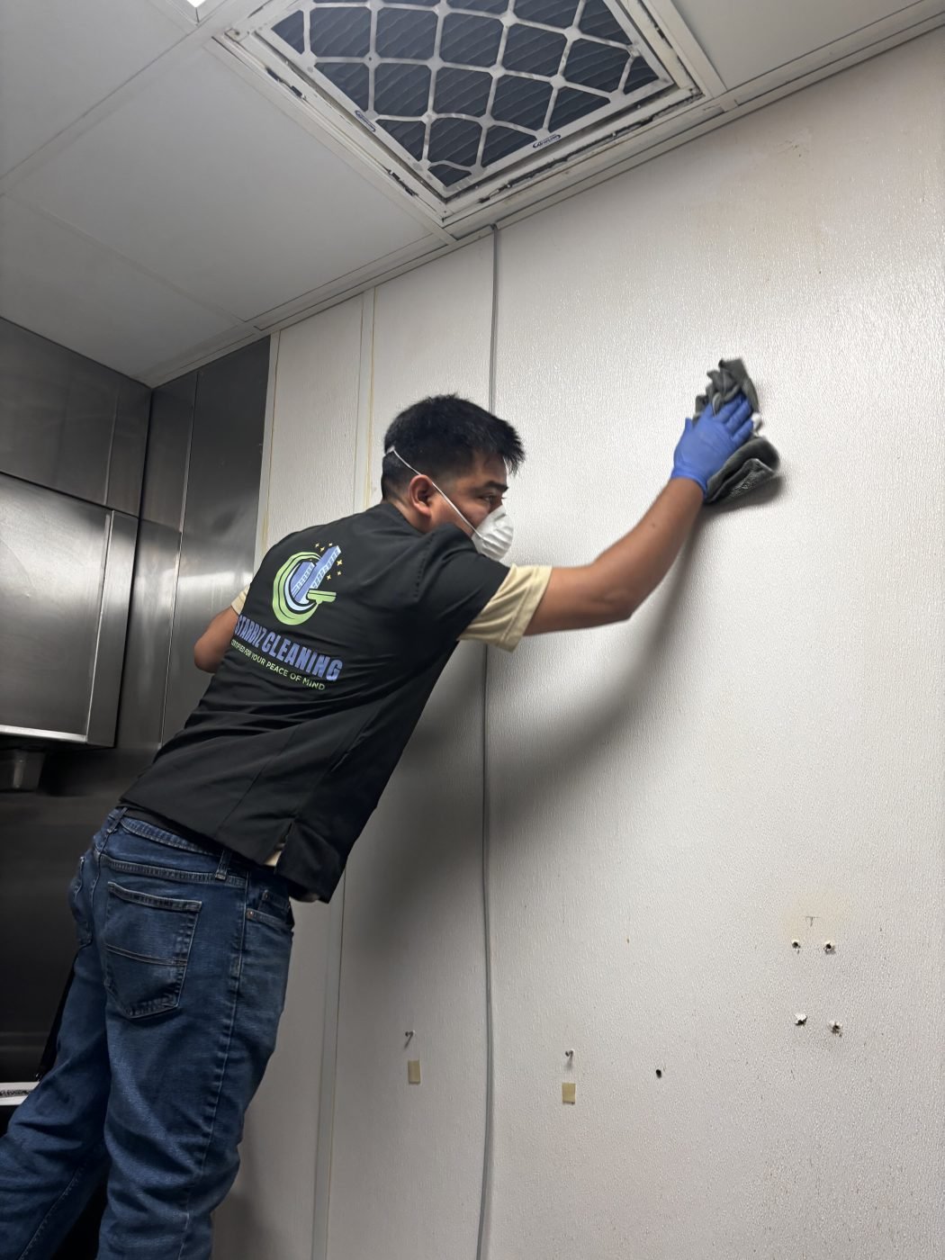 Crew cleaning the walls